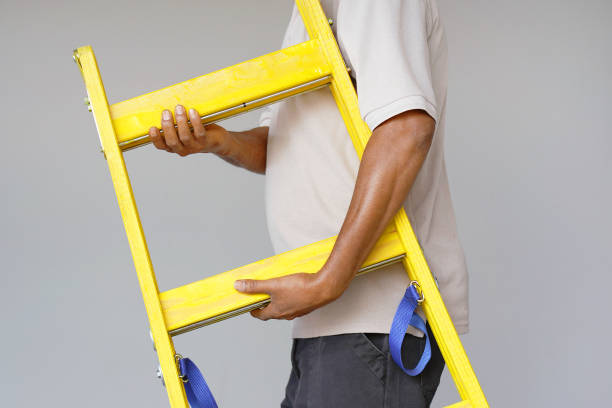 istock worker with wooden ladder 1062245328