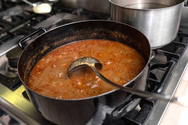 goulash on the stove stock photo