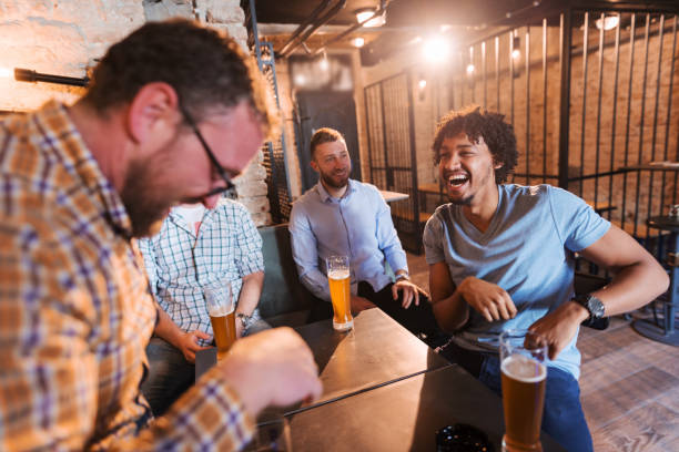 istock Men sitting in pub and having good time. 1062247062