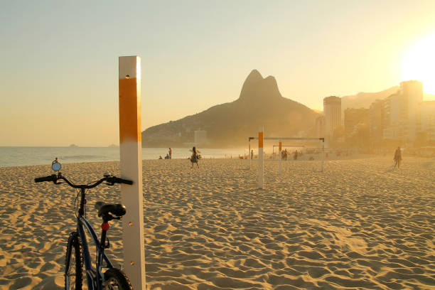 Bicycle at sunset from Ipanema, Rio de Janeiro. stock photo