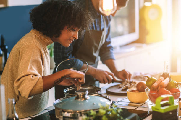 friends living and cooking together - vegetable men cutting adult imagens e fotografias de stock