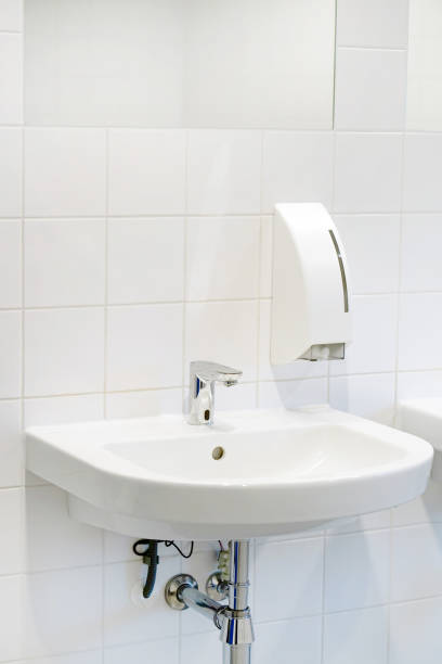 istock Modern white bathroom sink with faucet 1062250368