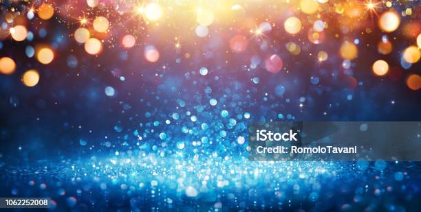 Abstract Glittering Blue Glitter With Golden Christmas Lights And Shiny Sparkling Background Stock Photo - Download Image Now