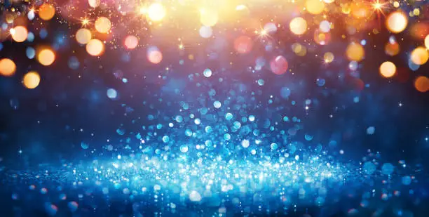 Photo of Abstract Glittering - Blue Glitter With Golden Christmas Lights And Shiny sparkling Background