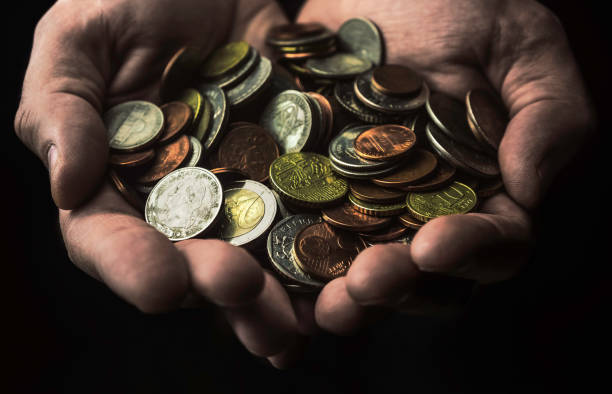 istock Hands full of coins 1062252748