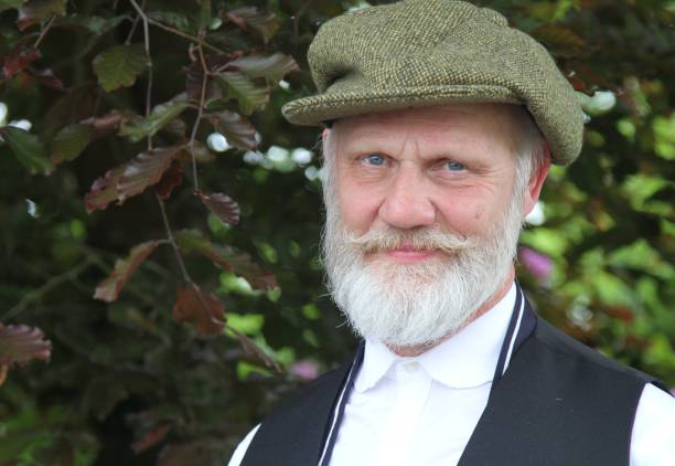 istock senior man in vintage clothing ,rural setting 1062252978
