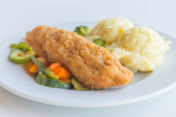 istock Chicken Kiev with vegetables and potatoes. Chicken breast with butter inside. 1062254642