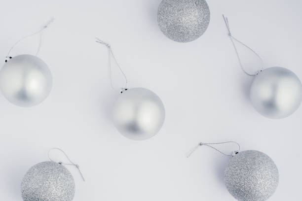 istock silver christmas decoration over white background, christmas pattern 1062255416