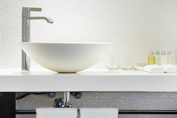 istock Modern white bathroom sink with faucet 1062255852