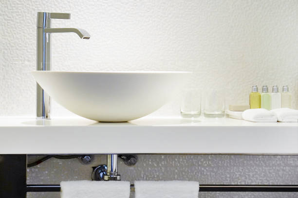 Modern white bathroom sink with faucet Bathroom interior sink with modern design. Interior of bathroom with washbasin and faucet bathroom sink stock pictures, royalty-free photos & images