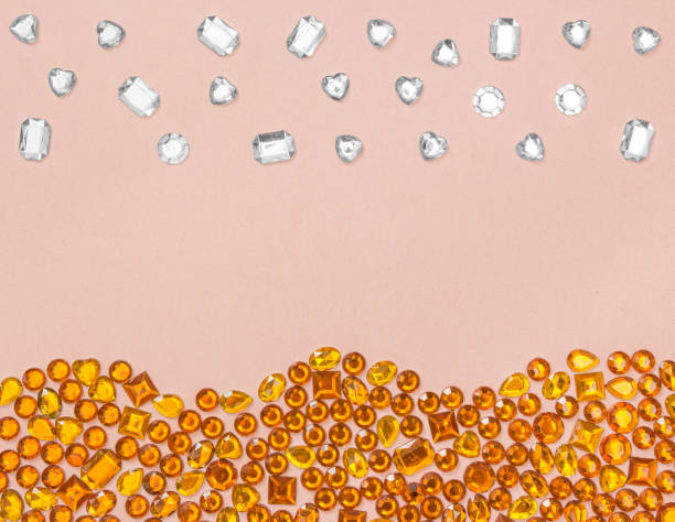 Rhinestones stones on pastel pink background