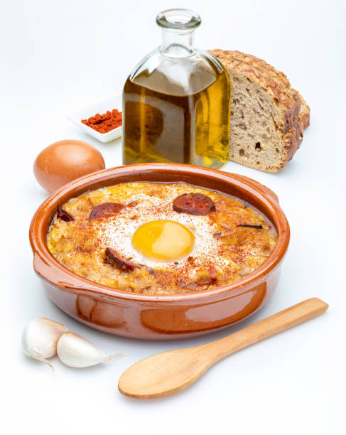 istock Garlic and bread soup ingredients (Spanish, from Spain). Isolated on white background 1062259536