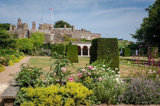 Walmer Castle & Gardens, UK - July  19,2018: Queen's Mother garden at Walmer Castle & Gardens - beautiful formal garden is visited by many tourists every year