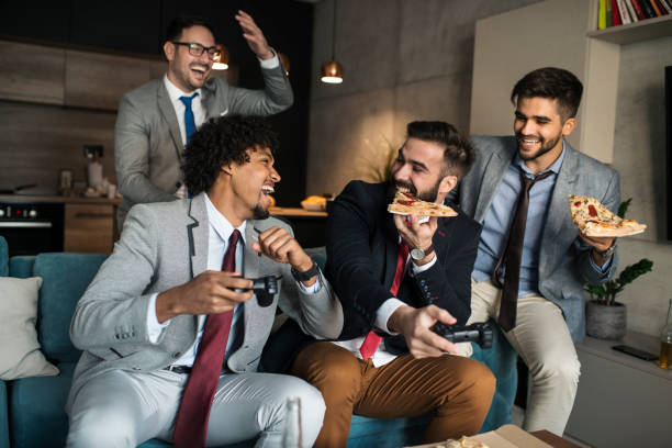 istock A group of young business man playing video games after work 1062263514