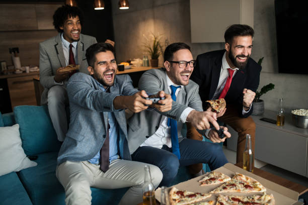istock A group of young business man playing video games after work 1062263780
