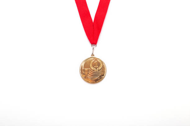 istock Gold medal with red ribbon on white background. 1062266784