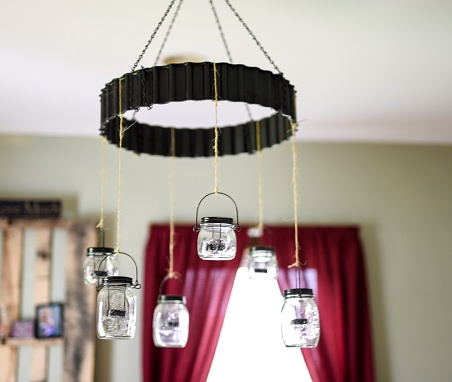 Beautiful mason jar chandelier with blurred background, colored image