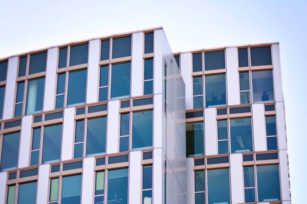 istock Modern office building facade abstract fragment, shiny windows in steel structure. 1062295218