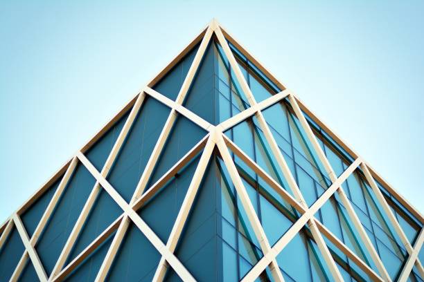 istock Modern office building facade abstract fragment, shiny windows in steel structure. 1062295448