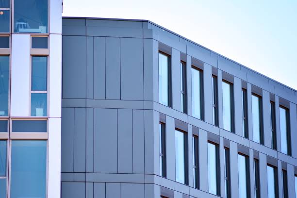 istock Modern office building facade abstract fragment, shiny windows in steel structure. 1062295754