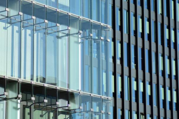 istock Modern office building facade abstract fragment, shiny windows in steel structure. 1062297362