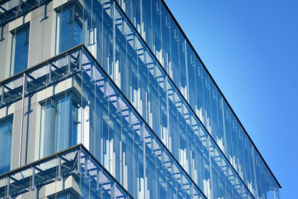 istock Modern office building facade abstract fragment, shiny windows in steel structure. 1062298550
