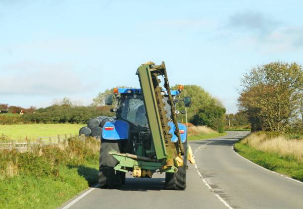 istock farm tractor on country road 1062299114
