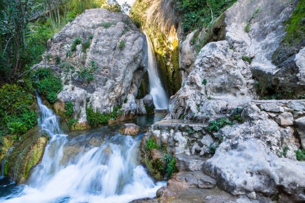 istock Picturesque Waterfall surrounded by rocks - Spain 1062300856