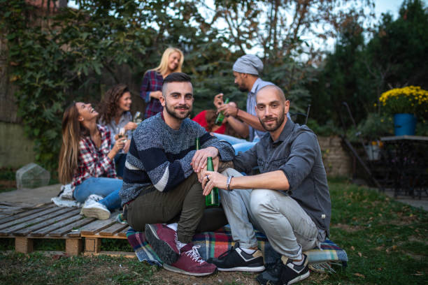 istock Diverse group of people enjoying their time in a back yard 1062302128