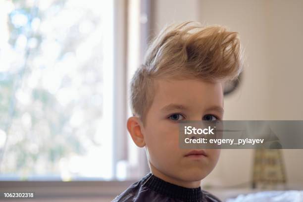 Cute Little Boy With Hairstyle Sitting At Home Stock Photo - Download Image  Now - Boys, Baby Boys, Teenage Boys - iStock