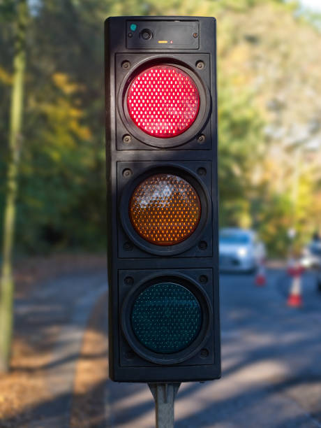 Close-up of temporary portable traffic signal for road works. Close-up of temporary portable traffic signal for road works. temporary stock pictures, royalty-free photos & images