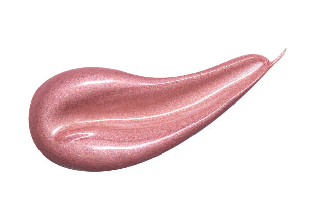 istock Lip gloss sample isolated on white. Smudged pink makeup product sample 1062314992