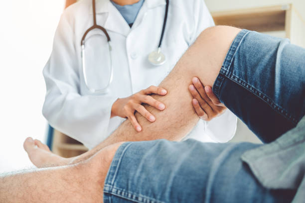 istock Doctor consulting with patient Knee problems Physical therapy concept 1062332230