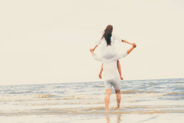 istock Couple going honeymoon on tropical beach in summer 1062334172