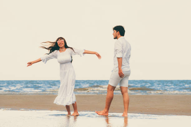 istock Couple going honeymoon on tropical beach in summer 1062334180