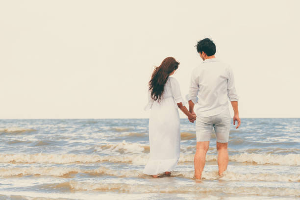 istock Couple going honeymoon on tropical beach in summer 1062334204