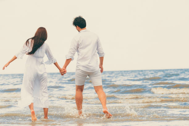 istock Couple going honeymoon on tropical beach in summer 1062334208