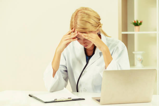 istock Serious doctor working in hospital office. 1062336726