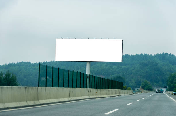 istock Blank billboard on blue sky background for new advertisement 1062339164