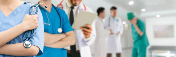 istock Doctor working in hospital with other doctors. 1062348696