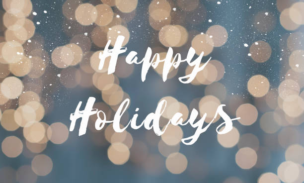 Greeting card happy holidays with defocused christmas lights as background