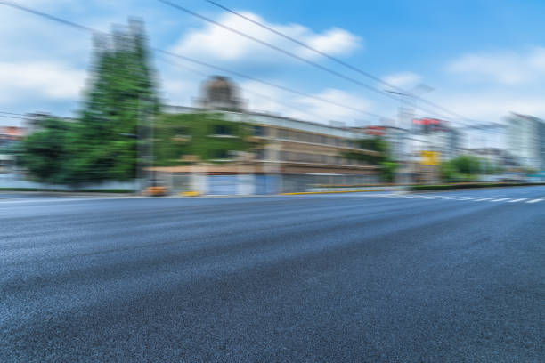 istock Empty road front of modern buildings 1062349274