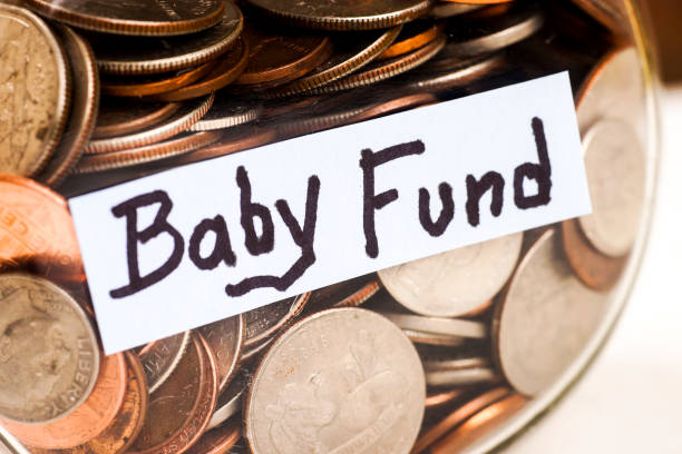 istock BABY FUND Label on Jar Filled with Coins 1062375044