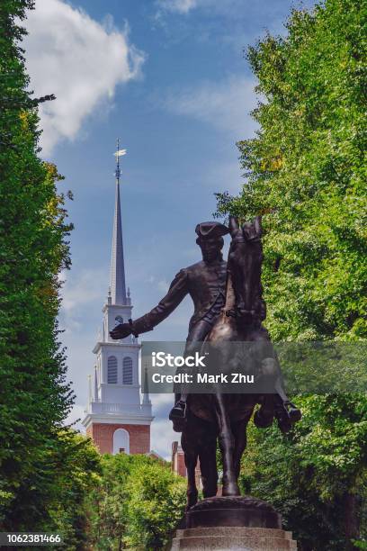 Statue Of Paul Revere And Spire Of Old North Church Between Trees In North End Boston Usa Stock Photo - Download Image Now