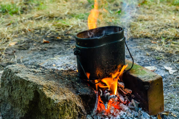 istock Cooking food in a kettle on bonfire 1062381550