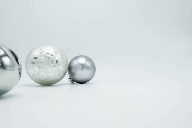 istock White and silver christmas balls isolated on white background. 1062381884