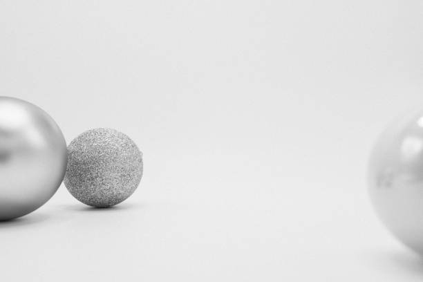 istock Silver, white and glittered monochrome Christmas baubles. 1062381938