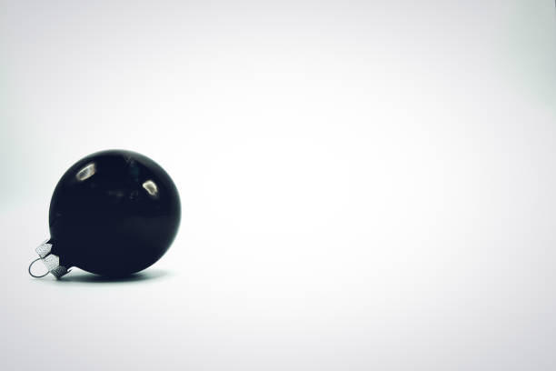istock Black Christmas decoration ball on white background. 1062382322