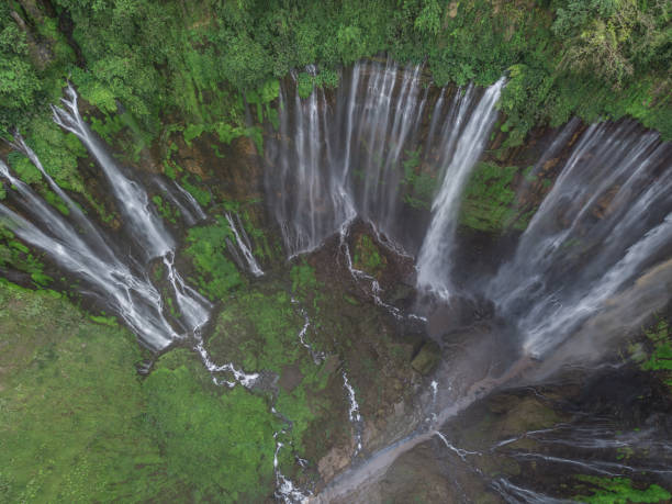 istock Birds-eye view of Coban Sewu waterfall in East Java 1062385724