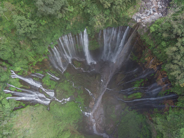 istock Aerial shot of Coban Sewu waterfall in East Java 1062385752